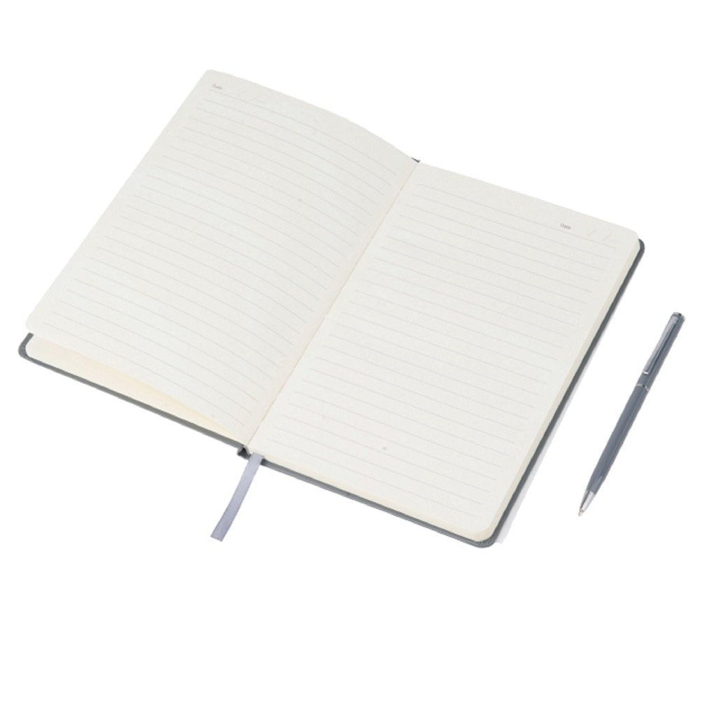 Open notebook with a ballpoint pen beside it