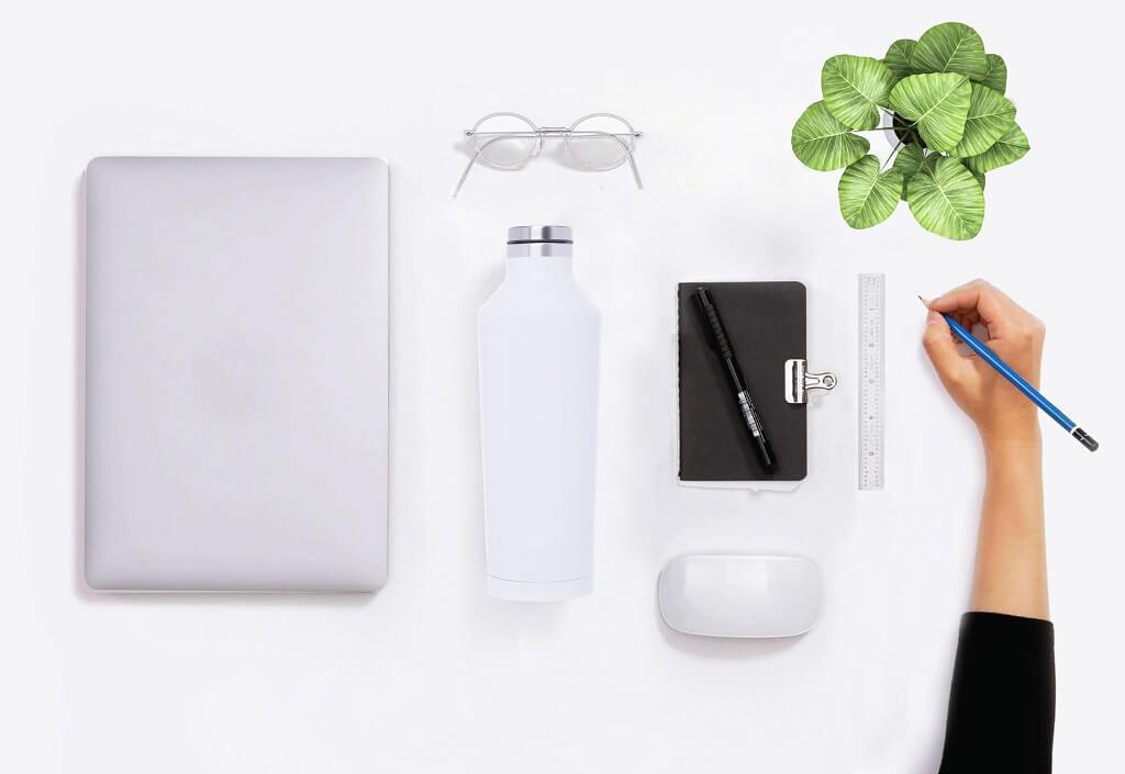 White stainless steel bottle combined with other office accessories